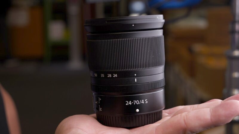 Nikkor 24-70mm f/4 Z in hand