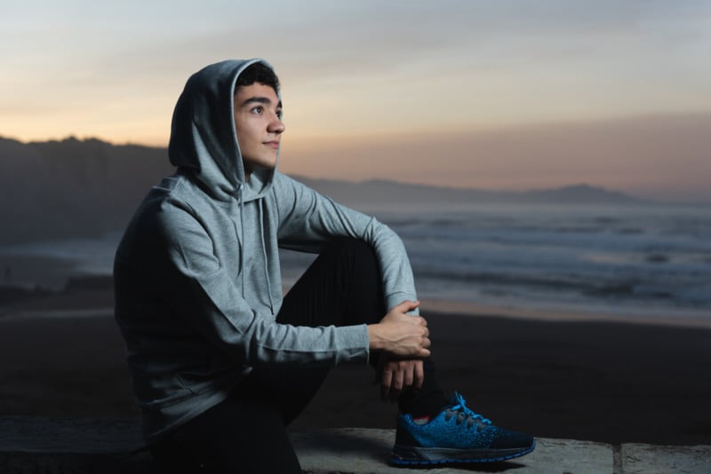 A portrait of a young man at twilight